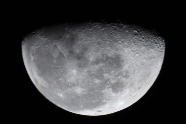 About us. An image of a half moon